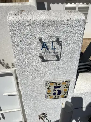 a white building with aaa sign on the side of it at Vilamoura Eden Villa With Pool by Homing in Vilamoura