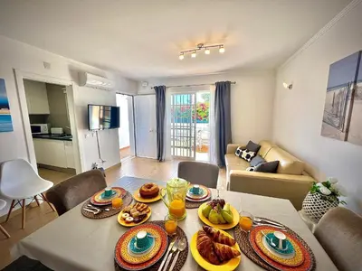 a living room with a table with food on it at Vilamoura Eden Villa With Pool by Homing in Vilamoura