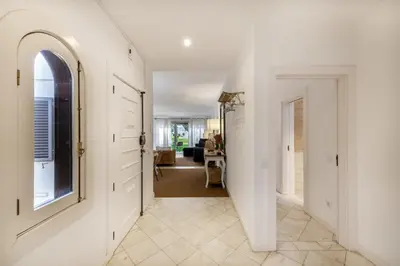 a hallway with white walls and an archway at Vilamouratenis Wave by SAPvillas in Vilamoura
