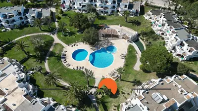 an aerial view of a resort with two swimming pools at #214 Vivenda 3 Quartos by Home Holidays in Albufeira