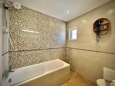 a bathroom with a white sink and a mirror at Albufeira Balaia Golf Vilage 6 With Pool by Homing in Albufeira
