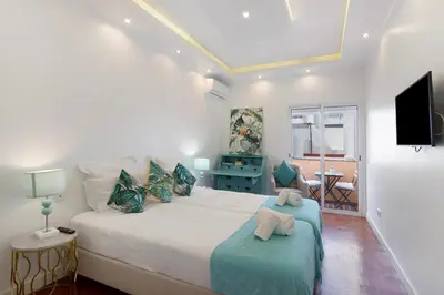 a bathroom with a sink and a shower at Luxury Home Sweet Home T3 in Faro