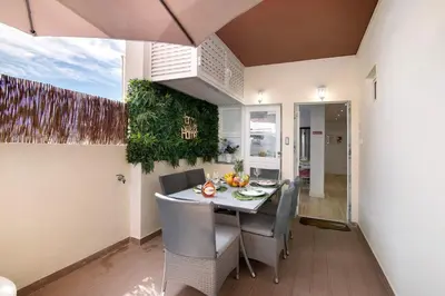 a dining room with a table and chairs at Luxury Home Sweet Home T3 in Faro