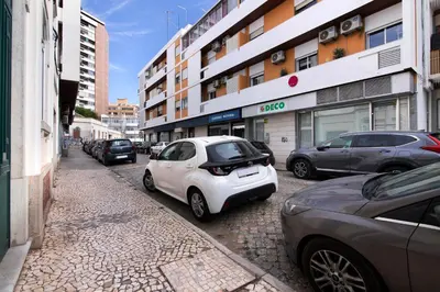a white car parked on the side of a street at Luxury Sweet Homes T2 in Faro