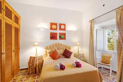 a bathroom with a toilet and a sink and a shower at Country House Quinta da Ilda in Loulé