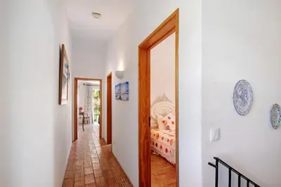 a hallway with a door leading to a bedroom at Country House Quinta da Ilda in Loulé