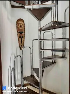 a metal shelf with a mask on a wall at RoofTOP Everest : vue mer panoramique amazing in Albufeira