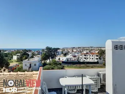 a balcony with a table and a view of the city at RoofTOP Everest : vue mer panoramique amazing in Albufeira