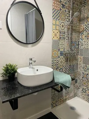 a bathroom with a sink and a mirror at V8 Praia da Falésia, Albufeira in Olhos de Água