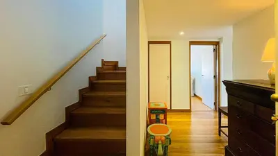 a room with a stairway with a toy on the floor at Penthouse Triplex Marina T2 by HsR Vilamarina in Quarteira