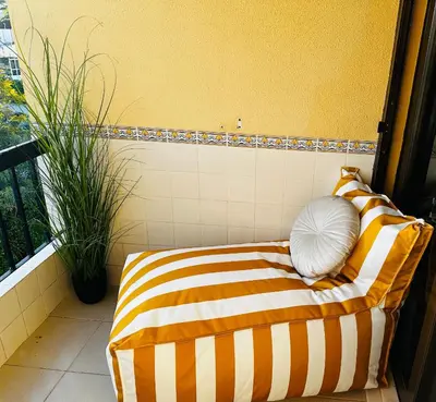a living room with a table and chairs at Sea View, Beach 3 minutes in Albufeira