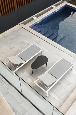 two chairs and a table next to a swimming pool at Buganvilia - Luxury villa - private pool by HD in Vale Formoso