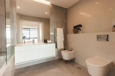 a bathroom with a sink and a toilet and a tub at Buganvilia - Luxury villa - private pool by HD in Vale Formoso