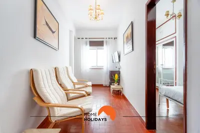 a living room with two chairs and a couch at #217 Dom Afonso III by Home Holidays in Albufeira
