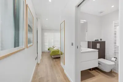 a white bathroom with a sink and a toilet at Terracos de Quarteira Blue by Real Properties in Quarteira
