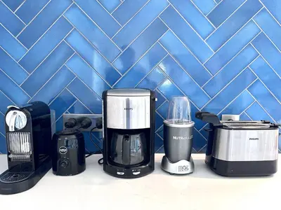a group of appliances sitting next to a blue wall at Algarve country villa near Loulé, stunning views in Romão