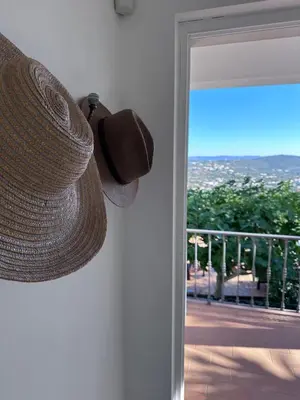 a hat hanging on a wall next to a door at Algarve country villa near Loulé, stunning views in Romão