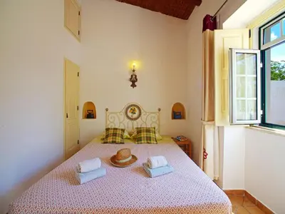 a bedroom with a bed with two towels on it at Holiday Home Monte da Calma by Interhome in Albufeira