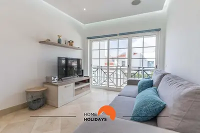 a living room with a couch and a tv at #228 Garrett Flats by Home Holidays in Albufeira
