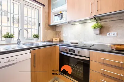 a kitchen with a sink and a stove top oven at #228 Garrett Flats by Home Holidays in Albufeira