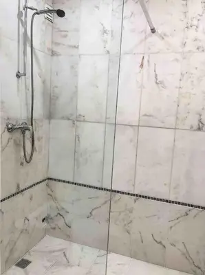 a shower with a glass door in a bathroom at OURA WHITE VIEW Beach 2 min walk sea in Albufeira