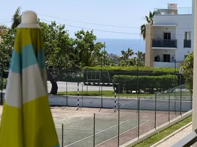 a tennis court in front of a tennis court at ELdorado JArdim open view beach 5 minutes foot in Albufeira