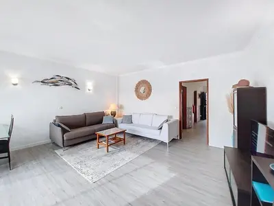 a living room with a couch and a table at Silmaria Sea View amazing in Albufeira