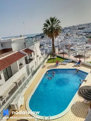 a view of a swimming pool on top of a building at Silmaria Sea View amazing in Albufeira