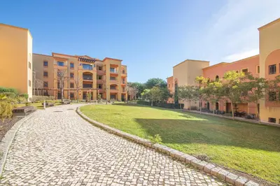a cobblestone street in front of a building at The Residences Vilamoura, Apartment Melissa in Vilamoura