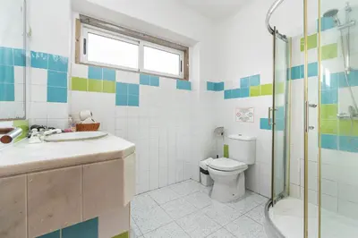 a bathroom with a toilet and a sink and a shower at Blife Riamya private apartment in Faro