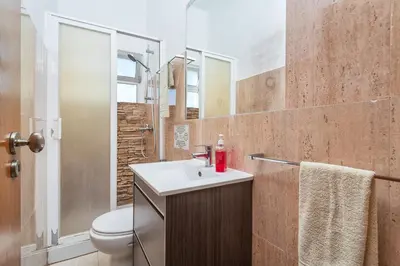 a bathroom with a sink and a toilet at Blife Vistaya private apartment in Faro