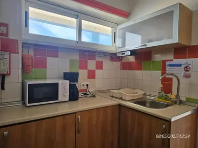a kitchen with a sink and a microwave at Blife Vistaya private apartment in Faro