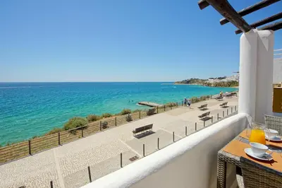 a balcony with a view of the beach at Beach Residence Old Town in Albufeira