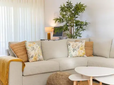 a living room with a couch and a table at Serenity 06 House by Stay ici Algarve Holiday Rental in Albufeira