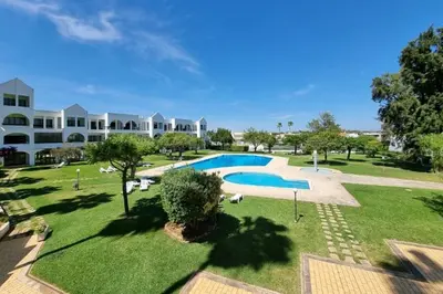 an aerial view of a resort with a swimming pool at Blue Palmtree in Albufeira