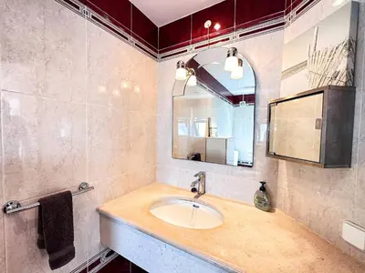 a bathroom with a sink and a mirror at Villa Sarah by BeCherish in Quarteira