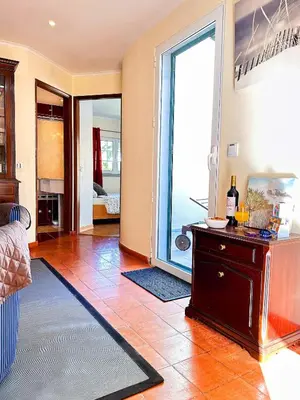 a living room with a large sliding glass door at Villa Sarah by BeCherish in Quarteira