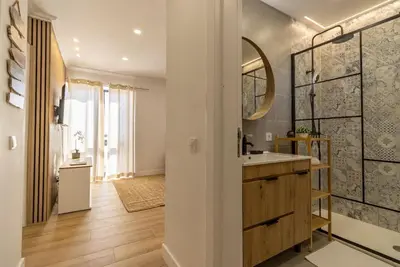 a bathroom with a sink and a mirror at Cosy apartment in Albufeira, OURA ST in Albufeira