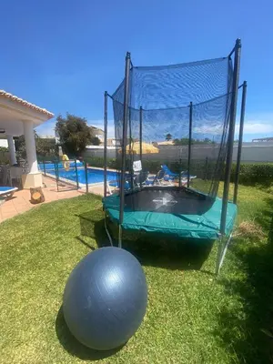 a large ball is next to a trampoline at Casa Luna with Saltwater Pool in Olhos de Água