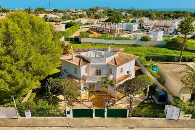 an overhead view of a white house with trees at Casa Luna with Saltwater Pool in Olhos de Água