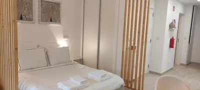 a bedroom with a bed with towels on it at Casa de Praia em São Rafael in Albufeira