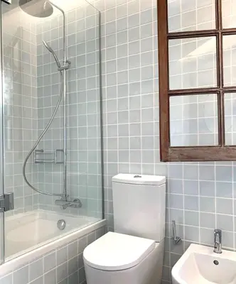 a bathroom with a toilet and a tub and a sink at VM Relax Beautiful villa with pool! VILAMOURA! in Quarteira