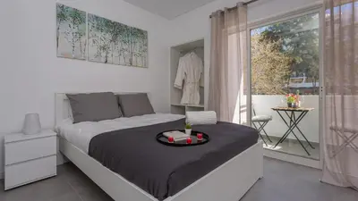 a bedroom with a bed with a tray on it at La Liberdad Loft in Albufeira