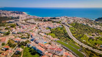 an aerial view of a city next to the ocean at Pateo Loft in Albufeira