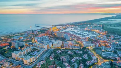 an aerial view of a city next to the ocean at Villa Del Sol by Algarve Vacation in Quarteira