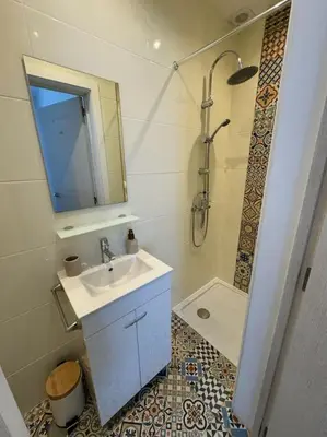 a small bathroom with a sink and a shower at Casa Nova Vida in Paderne