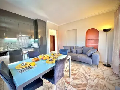 a living room with a table and a couch at Vilamoura Central 8 by Homing in Vilamoura