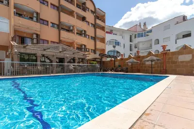 a swimming pool in front of a building at The Albufeira Concierge - Pool ChoroMar Apartment in Albufeira
