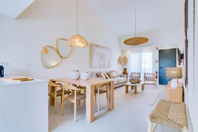 a kitchen and living room with a table and a couch at AL - Villas Country Club in Vilamoura