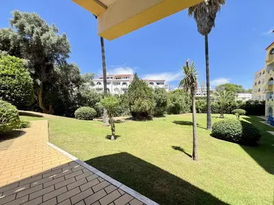 a park with palm trees and a building at Albufeira Tropical View 1 With Pool by Homing in Albufeira